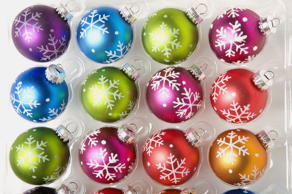 bright colored round ornaments in plastic package