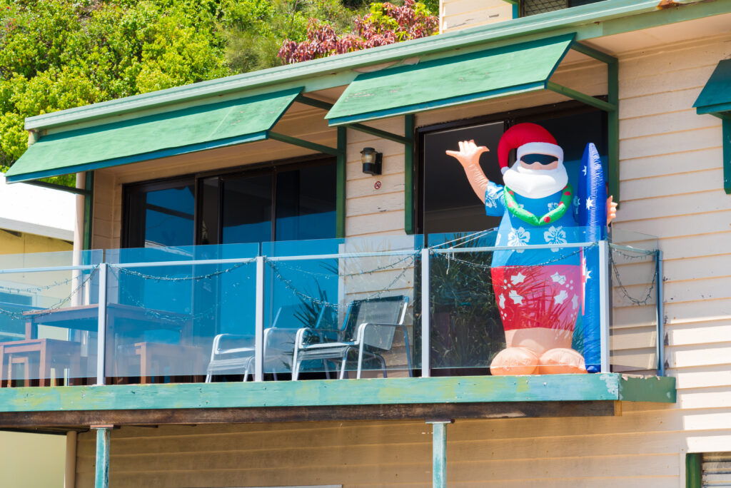 Inflatable Santa Claus at house balcony. 