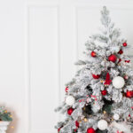flocked Christmas tree with red and white ornaments