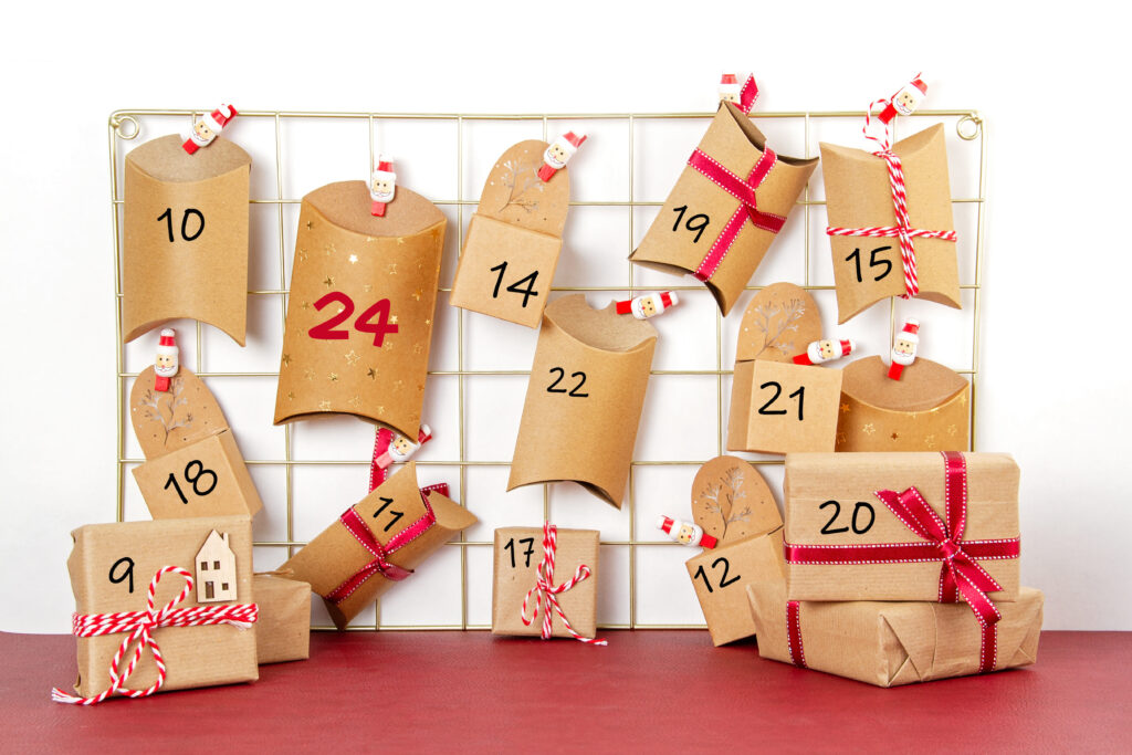 small cardboard boxes with red ribbons and numbers