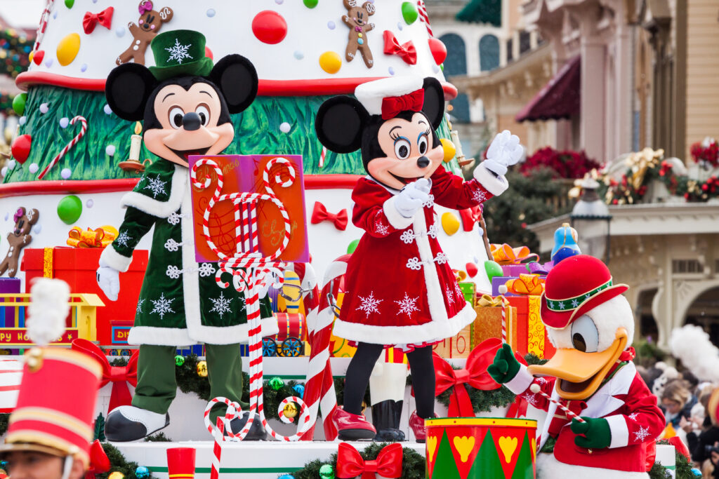Disney Christmas parade with Mickey, Minnie and a giant Christmas tree. 