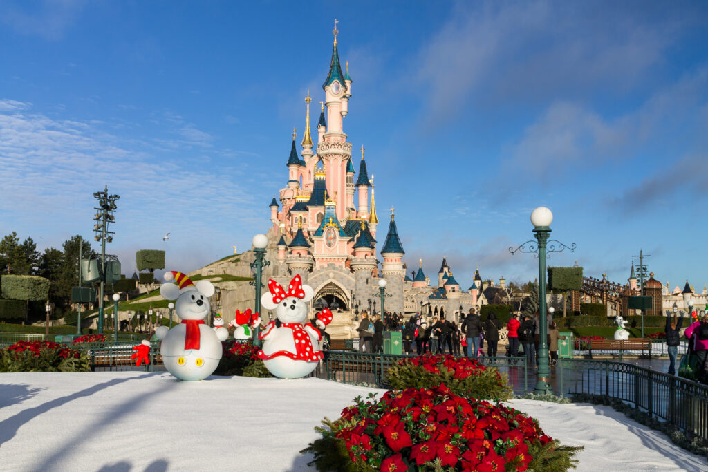 Disney at Christmas with snowman statue  or Minnie and Mickey. 