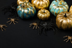spooky black and gold pumpkins with spiders