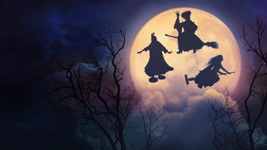 three witches fly past the moon